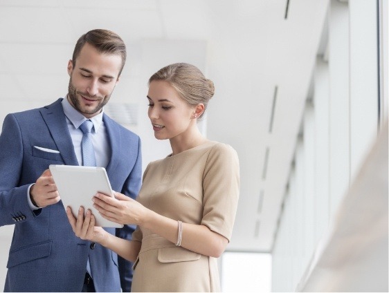 man and woman discussing paperwork